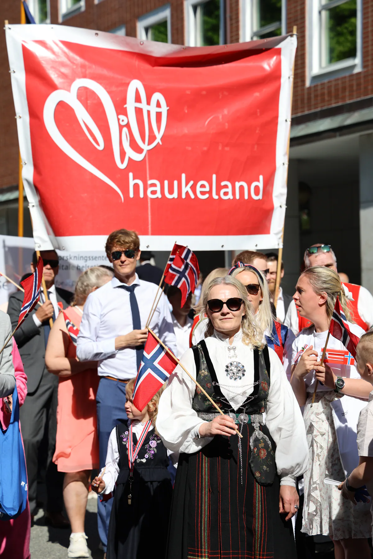 People carrying Norwegian flags in a Constitution Day procession in Bergen