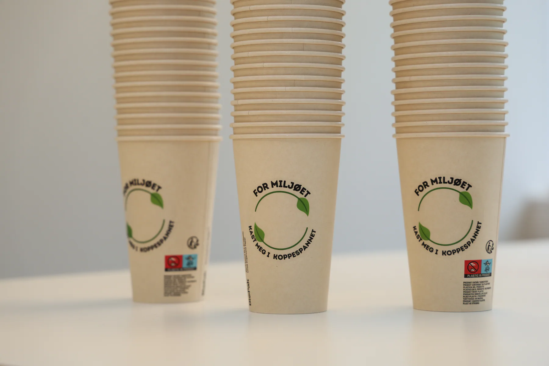 Stacks of paper cups carrying an environmental message
