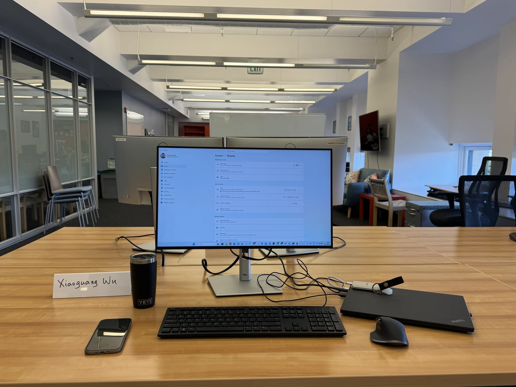 My SCANCOR workspace, with a monitor, laptop, and a name card reading Xiaoguang Wu.